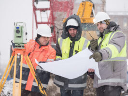 Construction workers in snow