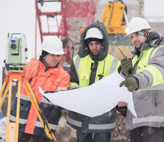 Construction workers in snow